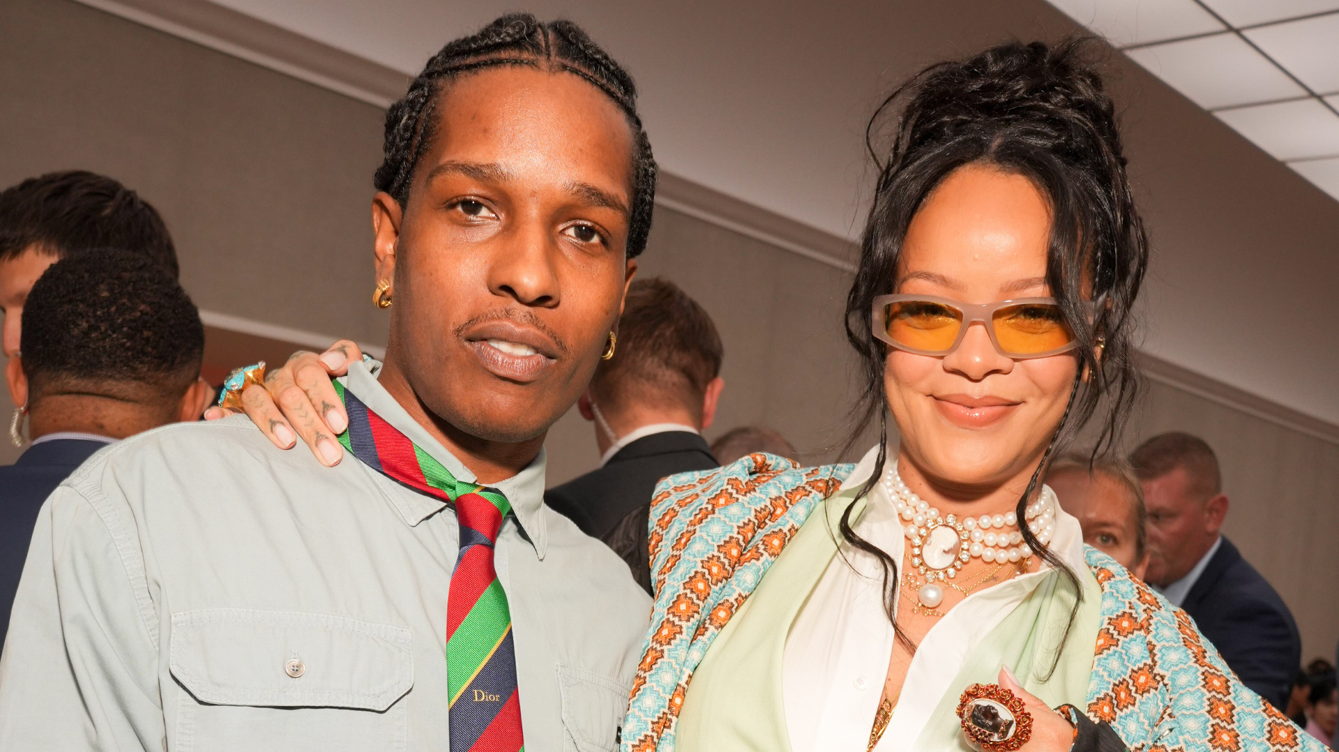 A$AP Rocky Says His Best Creation This Year Is Daughter R... 1 A$AP Rocky and Rihanna smiling at an event. A$AP Rocky wears a striped tie, while Rihanna sports sunglasses and a patterned jacket.